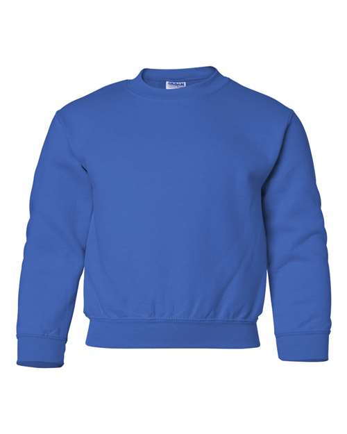 The Gildan 18000B is a solid royal blue, long-sleeve crewneck sweatshirt with ribbed cuffs, hem, and neckline. Made from Heavy Blend fabric and OEKO-TEX certified for safe, sustainable manufacturing. Displayed on a white background.