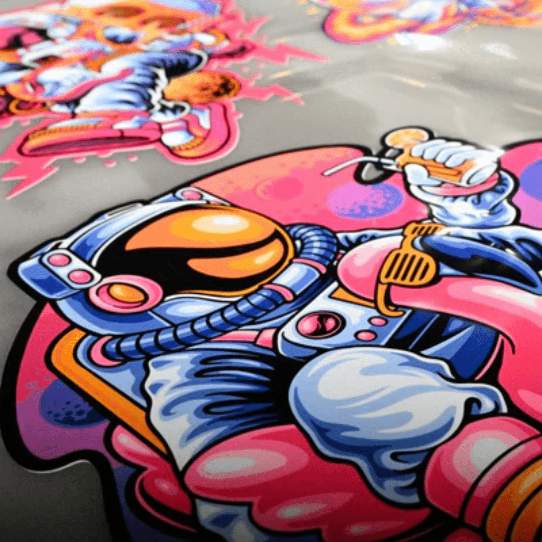 Customize your DTF gang sheet with DB Custom Creations Upload Your DTF Gang Sheet (Fluorescent)—add colorful astronaut stickers against vibrant pink, blue, and orange backgrounds for standout, high-quality transfers.