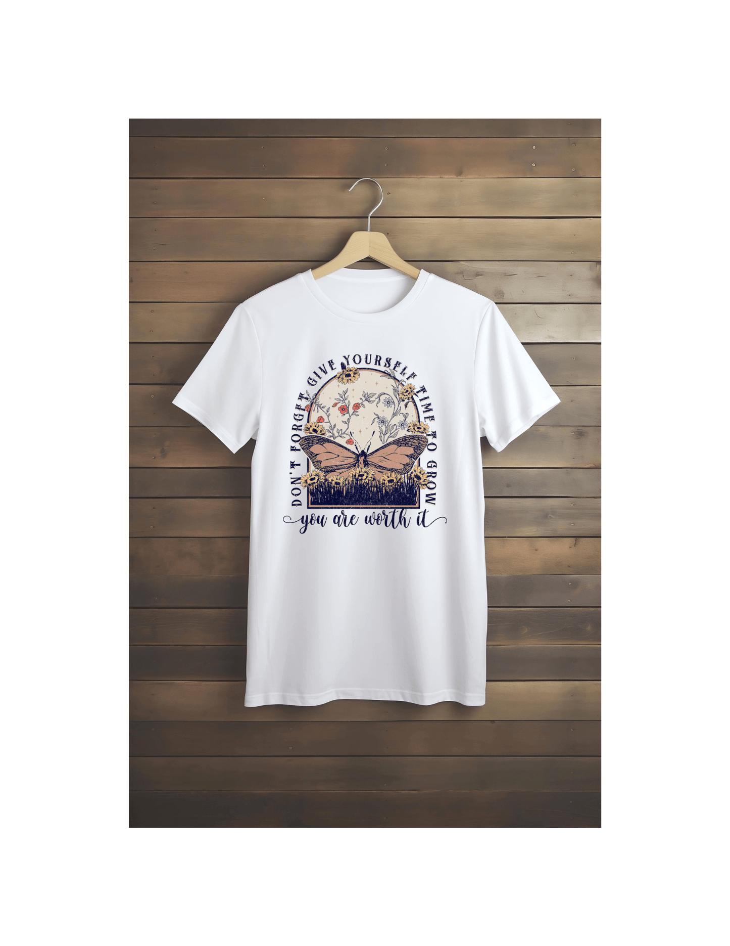 The Worth it Butterfly T-shirt by DB Custom Creations features a DTF Transfer of a butterfly and flowers with the inspiring message: Dont forget, give yourself time to grow. You are worth it. Displayed on a wooden wall.