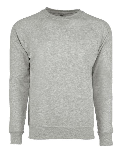 The Next Level 9000 is a light gray, long-sleeve crewneck sweatshirt with ribbed cuffs, collar, and hem, made from soft cotton-polyester fleece. No visible logos or designs; shown on a plain white background.