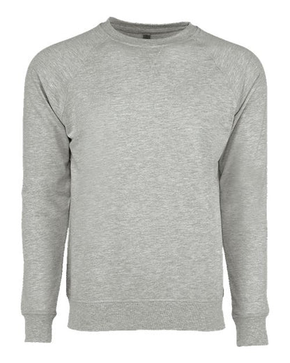 The Next Level 9000 is a light gray, long-sleeve crewneck sweatshirt with ribbed cuffs, collar, and hem, made from soft cotton-polyester fleece. No visible logos or designs; shown on a plain white background.