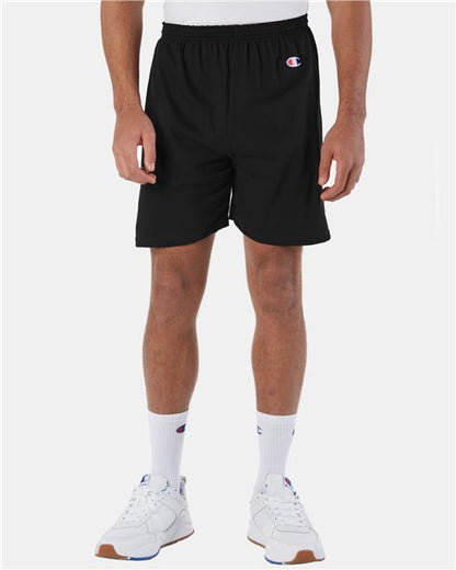 Someone is wearing Champion 8187 athletic shorts, styled with white crew socks and white sneakers featuring blue and red details, standing against a plain white background.