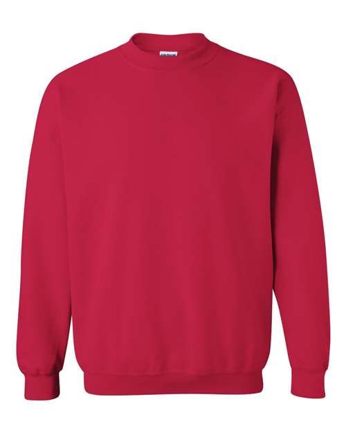 The Gildan 18000 is a plain red Heavy Blend sweatshirt with long sleeves and ribbed cuffs, collar, and hem, sustainably made and shown on a white background.