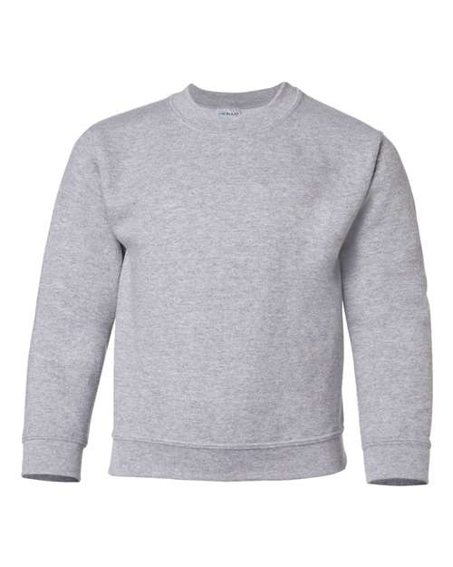 The Gildan 18000B is a plain, light gray crewneck sweatshirt with long sleeves and ribbed cuffs, collar, and waistband, made from Heavy Blend fabric and shown against a white background.