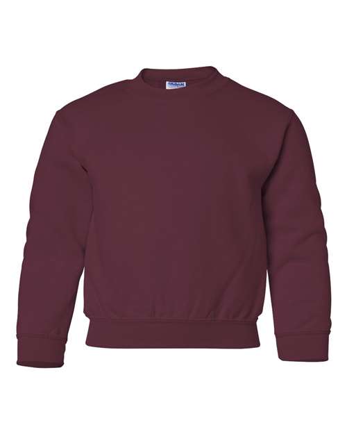 The Gildan 18000B is a plain maroon Heavy Blend crewneck sweatshirt featuring long sleeves with ribbed cuffs, collar, and waistband, shown against a white background.