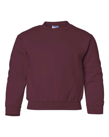 The Gildan 18000B is a plain maroon Heavy Blend crewneck sweatshirt featuring long sleeves with ribbed cuffs, collar, and waistband, shown against a white background.