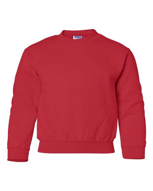 The Gildan 18000B is a plain red Heavy Blend crewneck sweatshirt with long sleeves and ribbed cuffs, hem, and collar, shown on a white background. OEKO-TEX certified for safety and comfort.