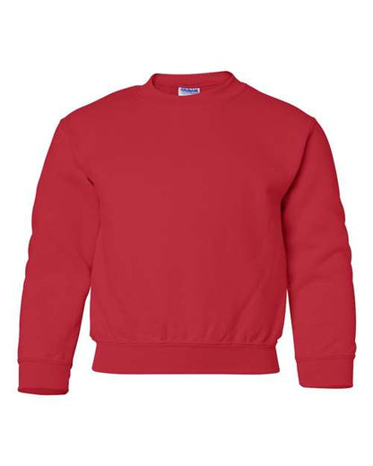 The Gildan 18000B is a plain red Heavy Blend crewneck sweatshirt with long sleeves and ribbed cuffs, hem, and collar, shown on a white background. OEKO-TEX certified for safety and comfort.