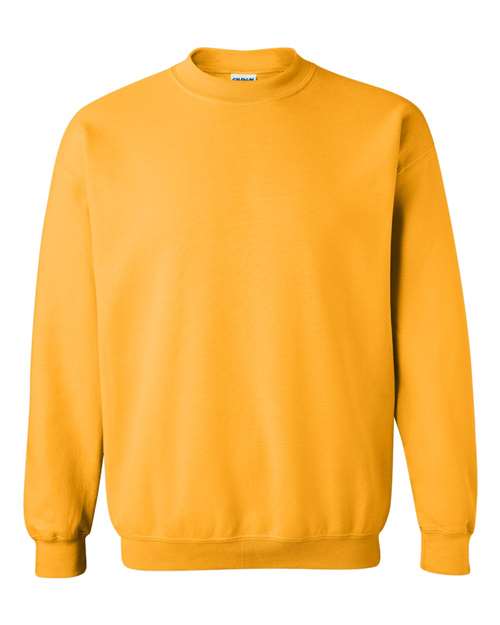 The Gildan 18000 is a plain, long-sleeve crew neck Heavy Blend sweatshirt in solid mustard yellow, OEKO-TEX certified for added peace of mind and shown on a white background.