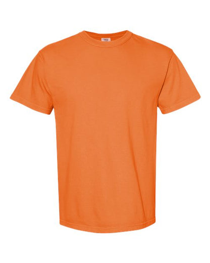 The Comfort Colors 1717 is a short-sleeve, crew neck orange t-shirt, garment-dyed and made from sustainable cotton, shown on a white background.
