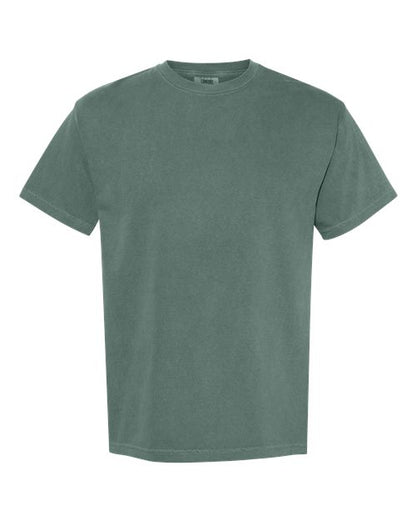 The Comfort Colors 1717 is a muted green, short-sleeve crew neck t-shirt made from sustainable cotton and garment-dyed for softness, shown on a white background.