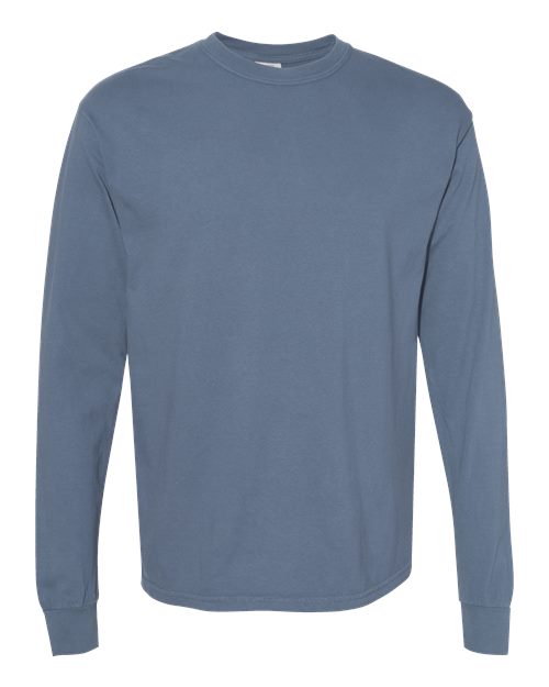 The Comfort Colors 6014 is a plain, long-sleeve, crew neck t-shirt in muted blue, shown on a white background. Made from soft ring spun cotton, it features no visible designs, logos, or patterns.