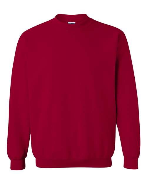 The Gildan 18000 is a plain red Heavy Blend sweatshirt featuring long sleeves, ribbed cuffs, and a ribbed waistband, shown against a white background.