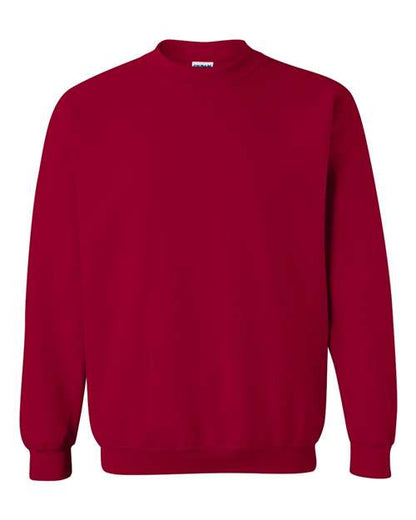 The Gildan 18000 is a plain red Heavy Blend sweatshirt featuring long sleeves, ribbed cuffs, and a ribbed waistband, shown against a white background.