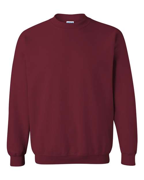 A plain, long-sleeved maroon Gildan 18000 Heavy Blend sweatshirt is shown on a white background. Made with OEKO-TEX certified materials, it features ribbed cuffs and waistband for comfort, with no visible logos or designs.