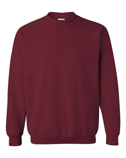 A plain, long-sleeved maroon Gildan 18000 Heavy Blend sweatshirt is shown on a white background. Made with OEKO-TEX certified materials, it features ribbed cuffs and waistband for comfort, with no visible logos or designs.