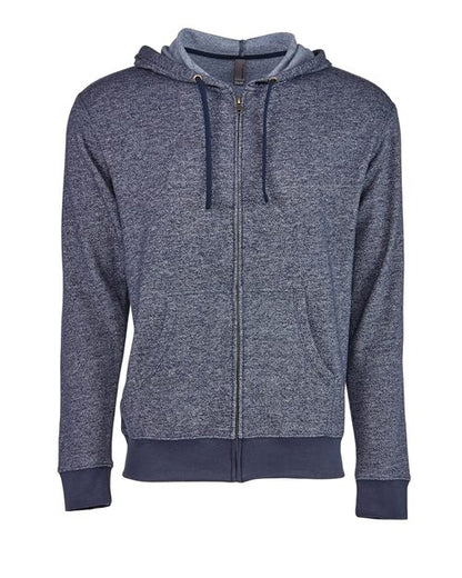 The Next Level 9600 is a blue heathered zip-up hoodie with a hood, drawstrings, front pockets, ribbed cuffs and hem, and an antique brass YKK zipper, crafted from denim-inspired fleece. Shown against a white background.