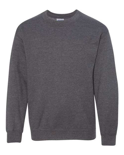 The Gildan 18000B is a plain, long-sleeve, crewneck sweatshirt in dark gray on a white background. Made with Heavy Blend fabric and ribbed cuffs and hem, it is logo-free and OEKO-TEX certified for trusted quality.