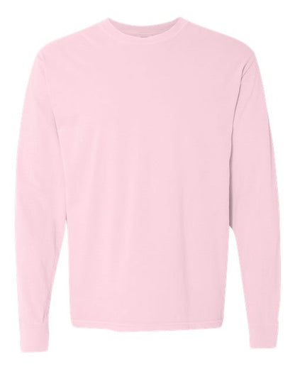 The Comfort Colors 6014 is a plain, light pink long-sleeve crew neck shirt made from soft ring spun cotton with no visible designs, logos, or patterns, displayed on a white background.