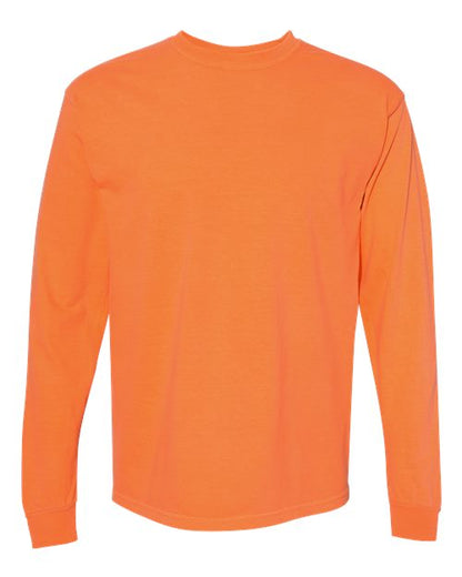 A plain, long-sleeve orange t-shirt (Comfort Colors 6014) is shown from the back with no designs or text. Made from soft ring spun cotton and garment-dyed, this tee emphasizes comfort and quality.
