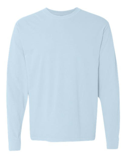 The Comfort Colors 6014 is a plain, light blue long-sleeve crew neck shirt made from soft ring spun cotton, shown against a white background with no visible logos or designs.
