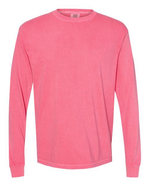 The Comfort Colors 6014 is a solid pink, long-sleeve, crew-neck t-shirt made from soft ring spun cotton, displayed on a white background.