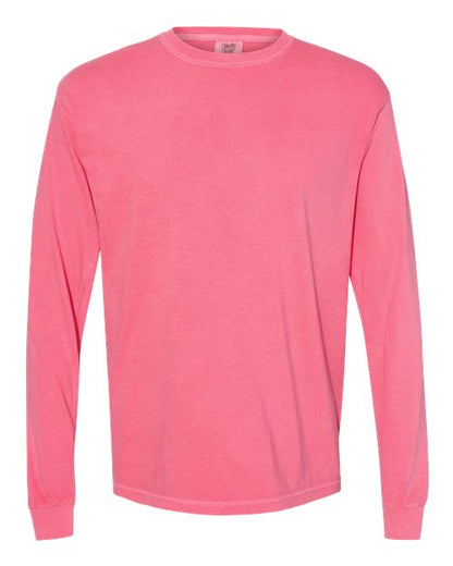 The Comfort Colors 6014 is a solid pink, long-sleeve, crew-neck t-shirt made from soft ring spun cotton, displayed on a white background.