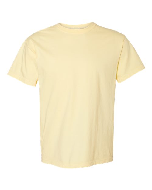 The Comfort Colors 1717 is a light yellow, short-sleeve crew-neck T-shirt made from sustainable cotton, shown on a white background.