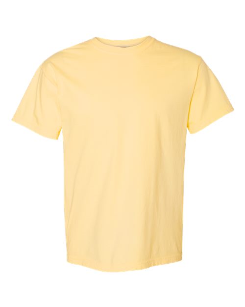 The Comfort Colors 1717 is a short-sleeve, garment-dyed t-shirt in light yellow, made from sustainable cotton and shown on a white background.