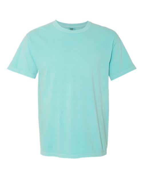 The Comfort Colors 1717 is a plain light blue, short-sleeve, garment-dyed t-shirt made from sustainable cotton, shown on a white background.