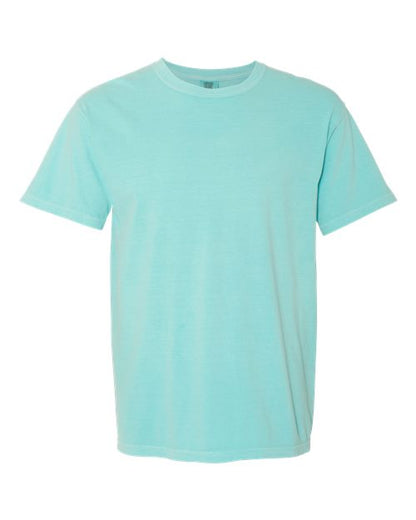 The Comfort Colors 1717 is a plain light blue, short-sleeve, garment-dyed t-shirt made from sustainable cotton, shown on a white background.