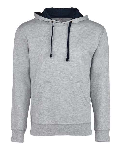 The Next Level 9301 is a light gray French terry fleece hoodie with black drawstrings and a front pocket, shown on a white background. Crafted with socially conscious manufacturing.