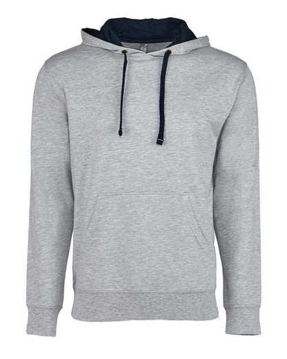 The Next Level 9301 is a light gray French terry fleece hoodie with black drawstrings and a front pocket, shown on a white background. Crafted with socially conscious manufacturing.