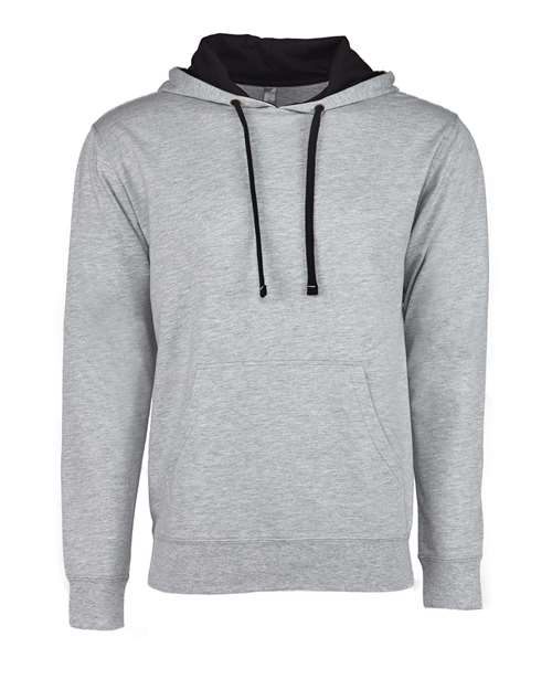 The Next Level 9301 hoodie is light gray with black drawstrings, a black hood lining, and a front pocket. Made from cotton polyester in a socially conscious facility, it’s shown on a plain white background.