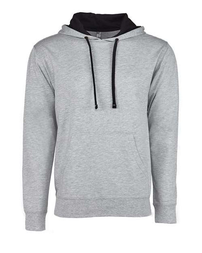 The Next Level 9301 hoodie is light gray with black drawstrings, a black hood lining, and a front pocket. Made from cotton polyester in a socially conscious facility, it’s shown on a plain white background.