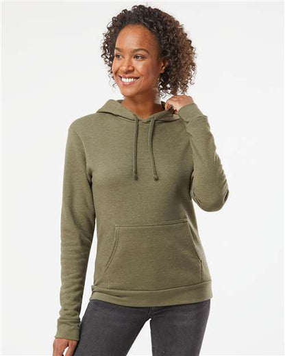 A woman models the Next Level 9302 olive green hooded sweatshirt, featuring soft cotton-polyester fleece, a front pocket, and drawstrings, against a plain white background. She smiles and looks to the side.