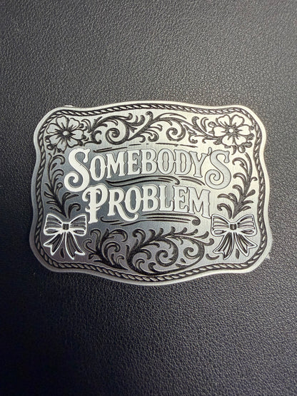 DB Custom Creations’ Custom Laser Engraved Tri Layered Acrylic Patches for Hats feature bold, stylized “Somebody’s Problem” text with floral and ribbon accents—perfect for pairing with contour cut patches or adhesive patches.