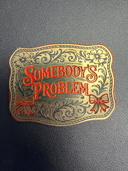 DB Custom Creations presents Custom Laser Engraved Tri Layered Acrylic Patches for hats—ornate floral and bow details with "Somebodys Problem" in bold red on textured gray, crafted with high-quality techniques for a lasting impression.