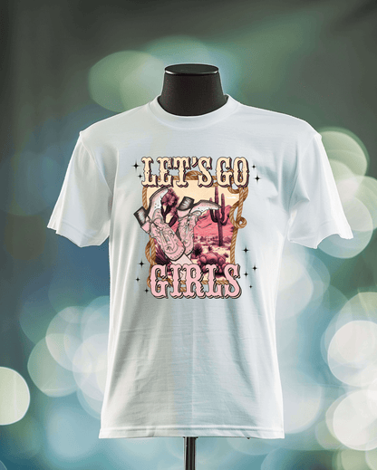 A white T-shirt from DB Custom Creations, called Lets Go Girls, features a graphic of a hand doing the rock-on gesture, cacti, and a desert scene, with LETS GO GIRLS in bold decorative letters above and below.