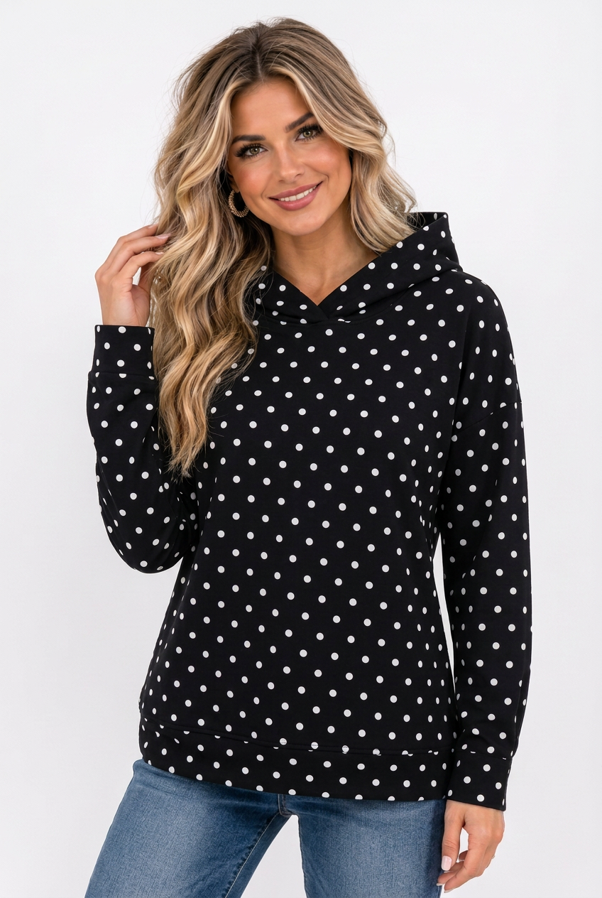 A woman wearing a black Polka Dot Hooded Sweatshirt and blue jeans.