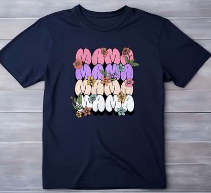 The MAMA tee by DB Custom Creations features retro block letters in pink, lavender, orange, and white with colorful flowers and green leaves. An 11-inch DTF print ensures vibrant detail on this navy shirt when laid flat.