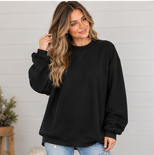 Woman wearing an oversized black Oversized Mock Neck sweatshirt in premium fabric.